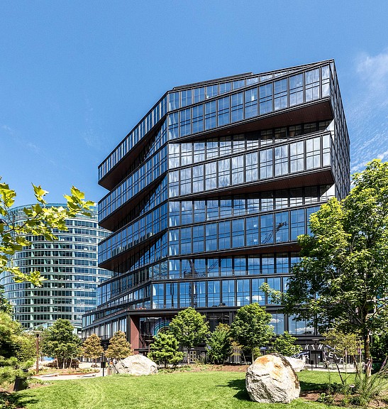 Exterior daytime image of 111 Harbor Way with grass and trees in the front