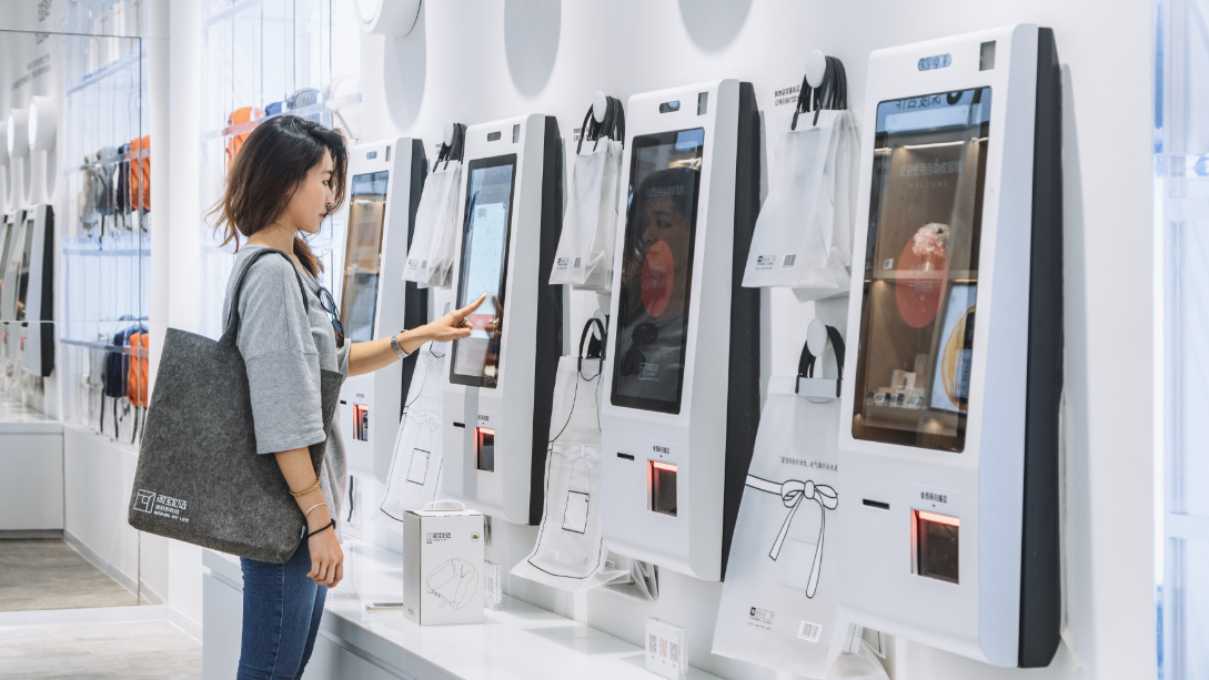 A person looking at a display.