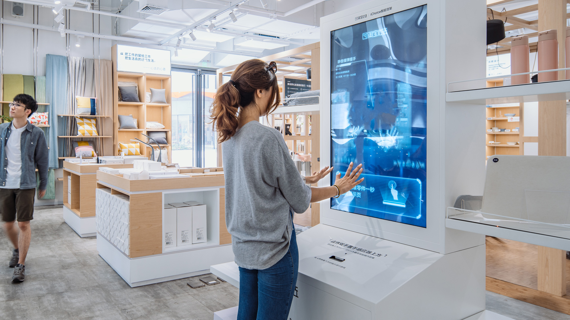 A person pointing at a screen.