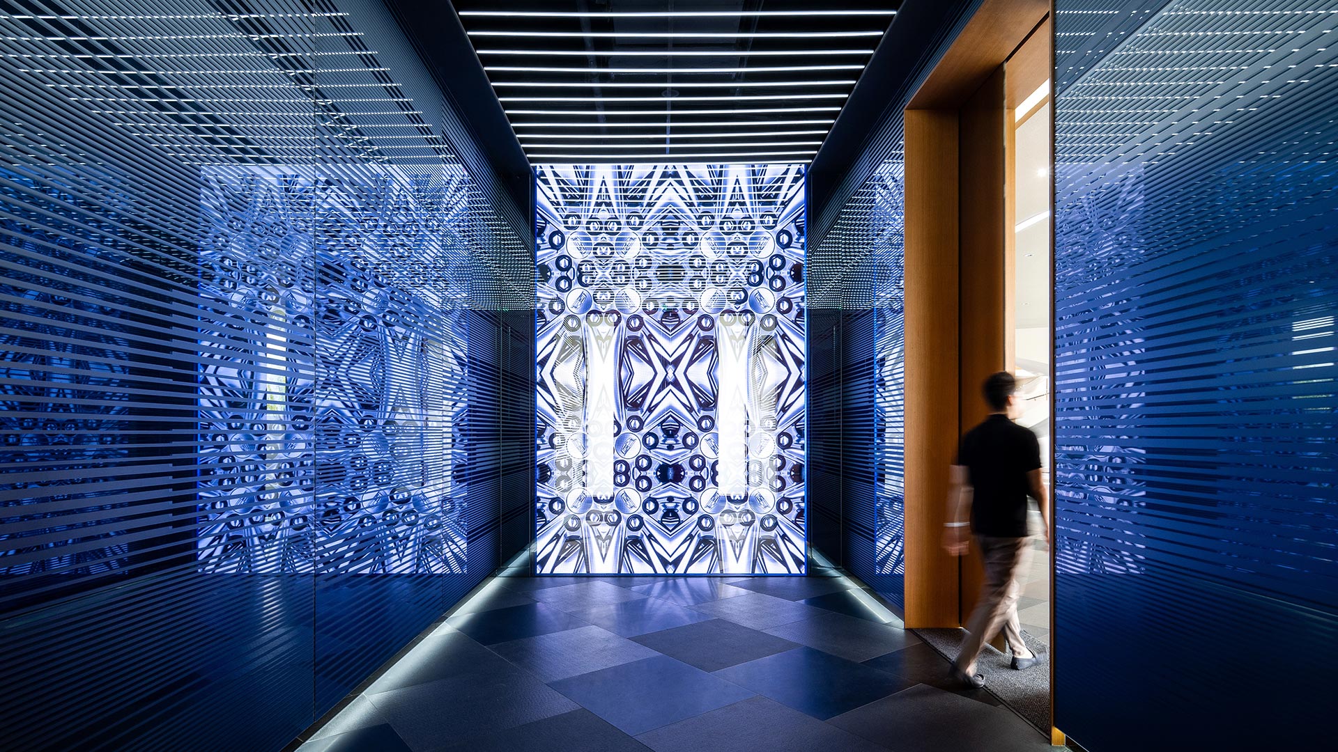 A person walking through a hallway.