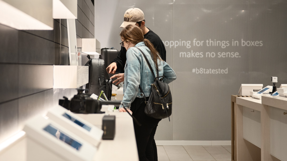 A couple of women looking at a display.