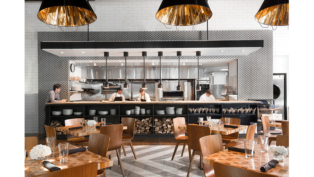 A restaurant with tables and chairs.