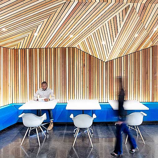 A group of people sitting at tables.