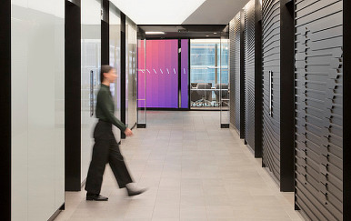 A person walking in a hallway.