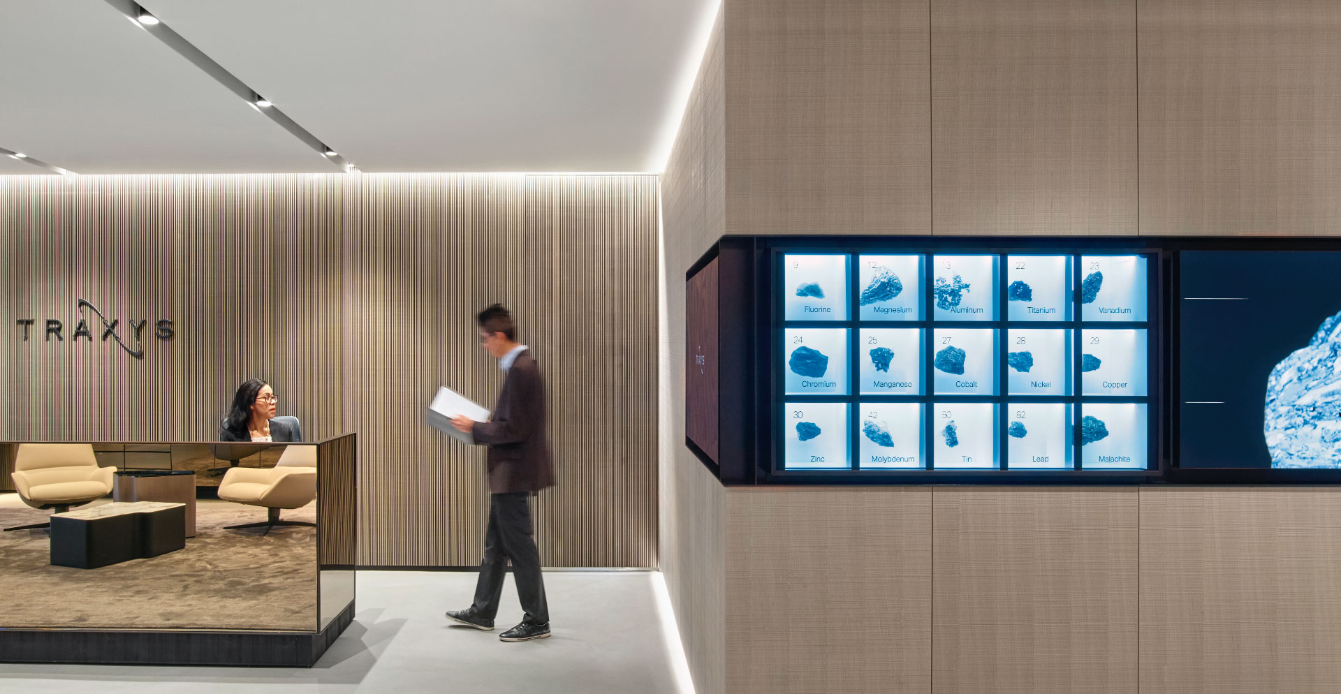 A person standing in front of a display of pictures.
