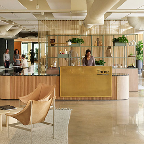 A person standing behind a counter.