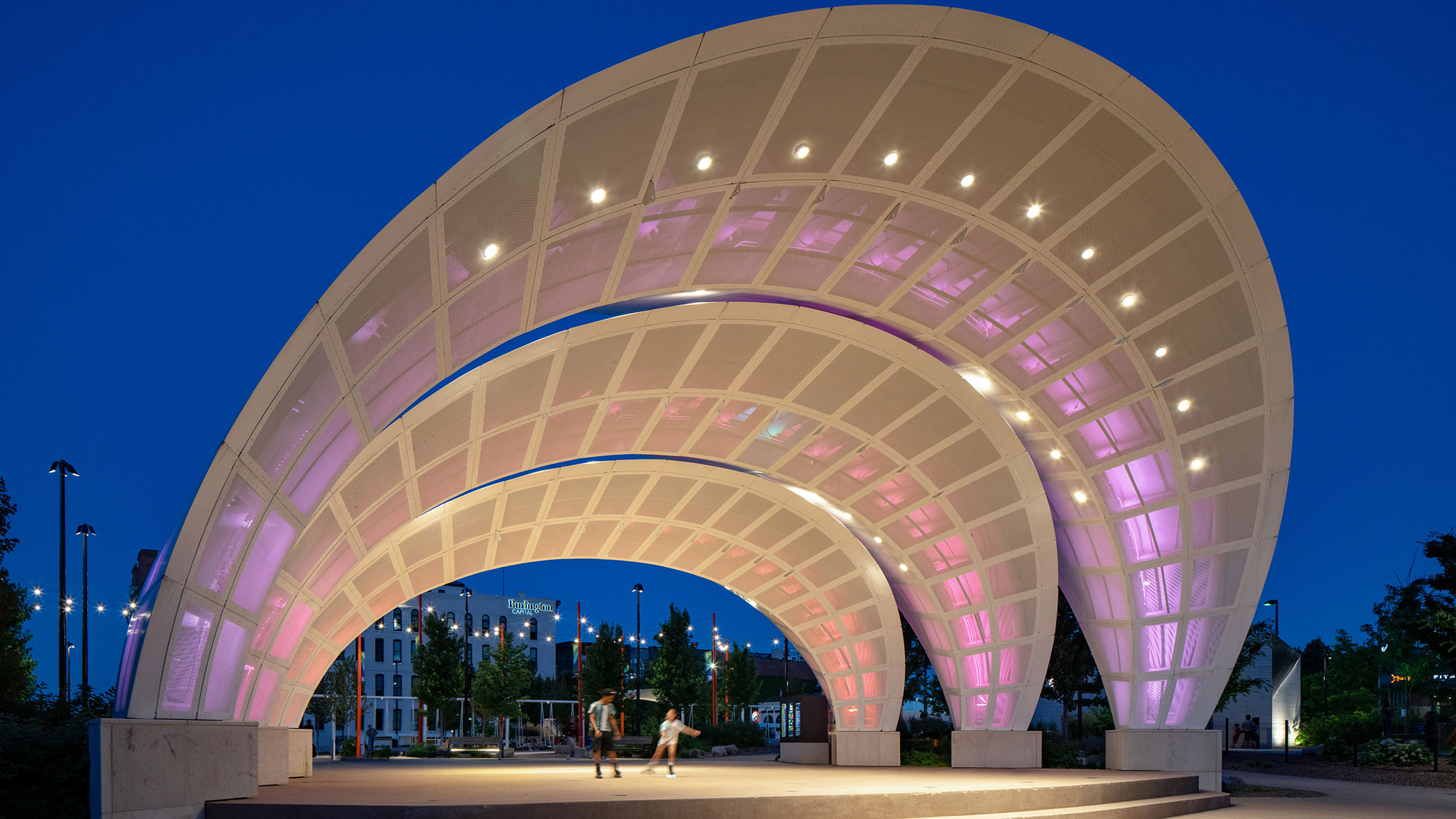 A large circular building with lights.