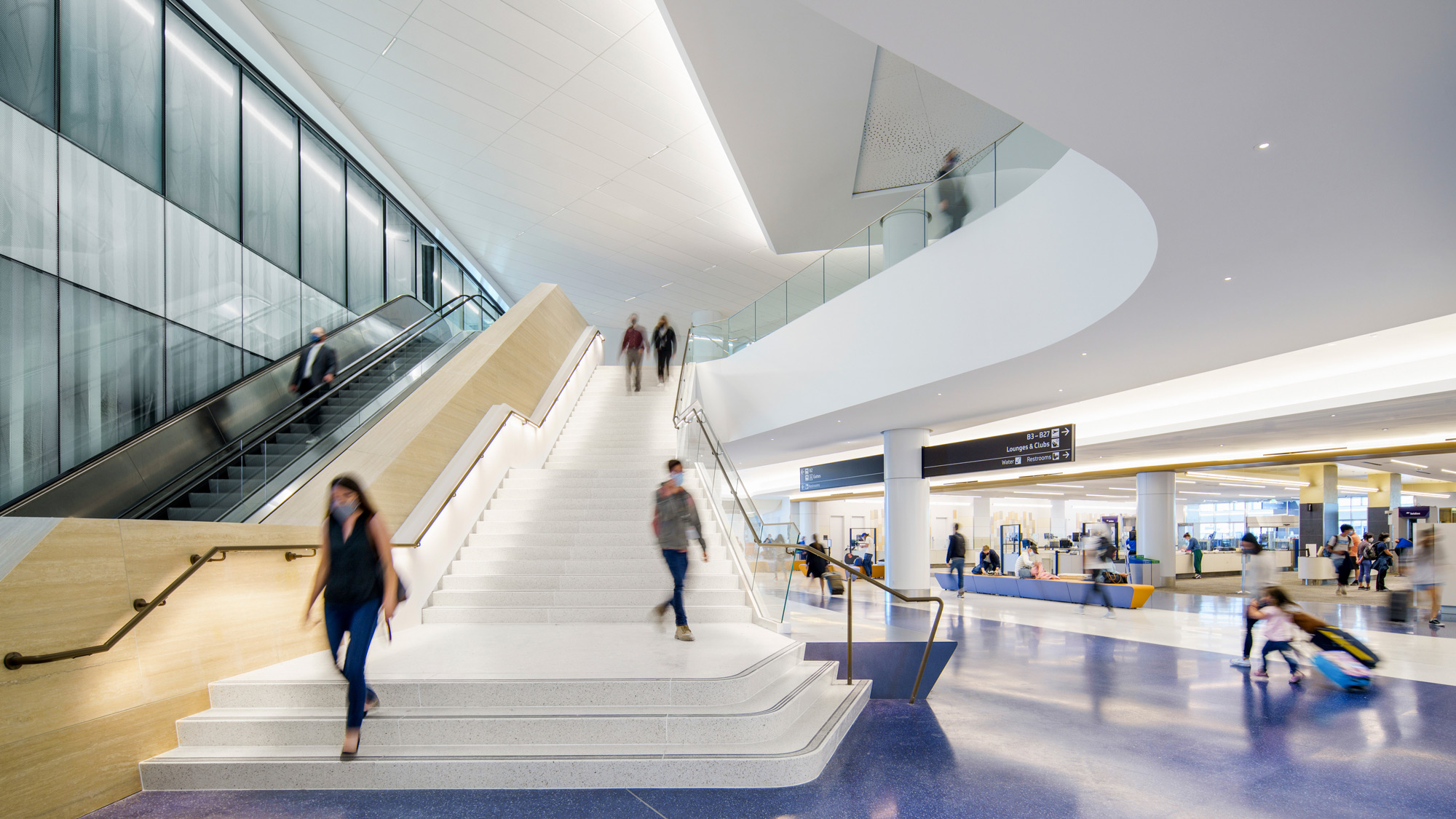 People walking down a flight of stairs.