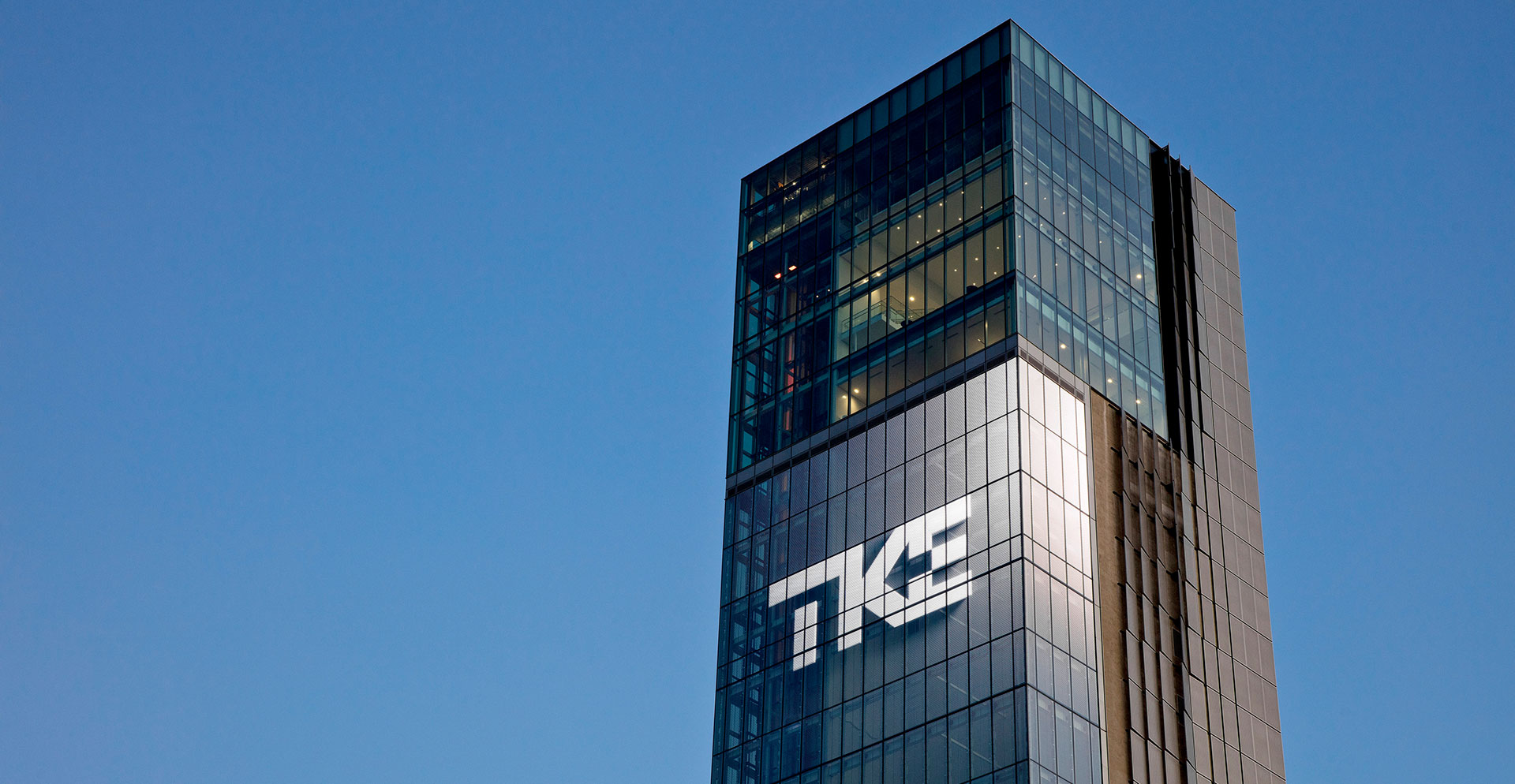 A tall building with glass windows.