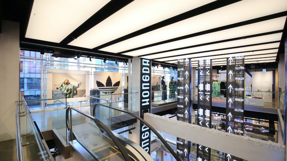 A glass walled building with a staircase.