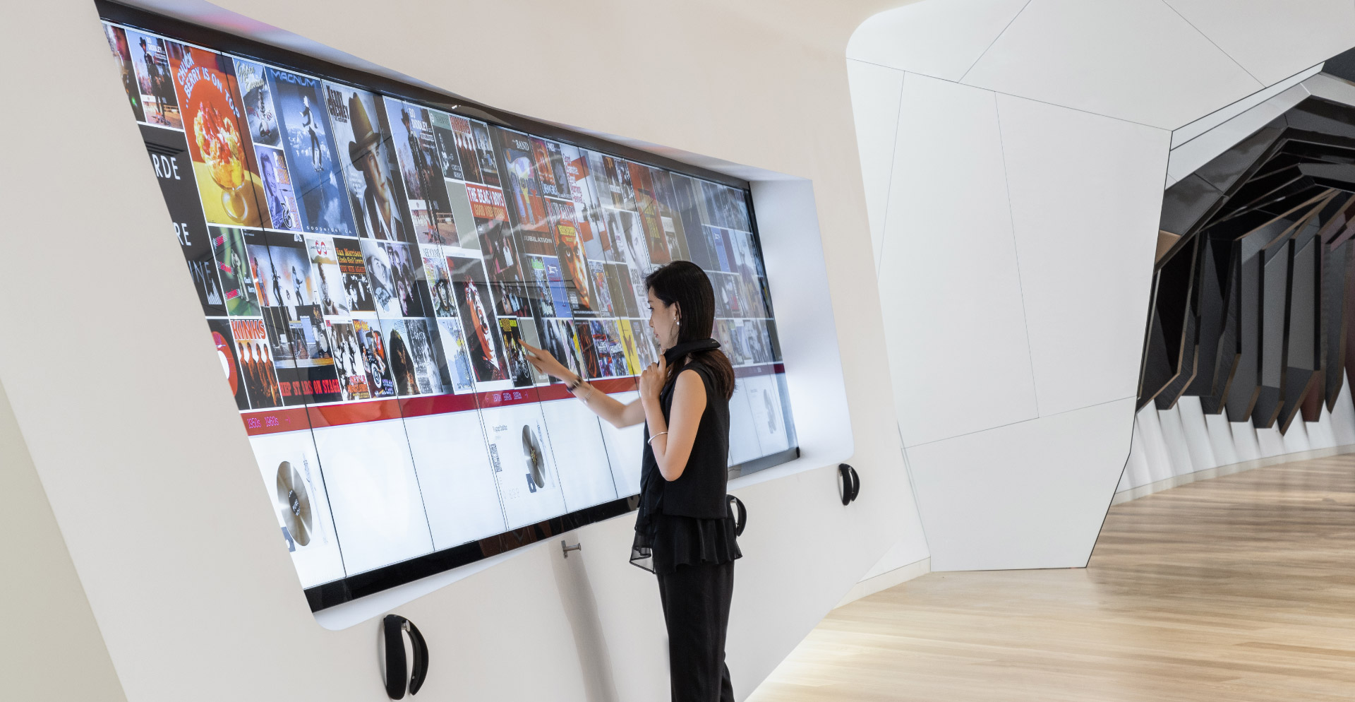 A person standing next to a display.