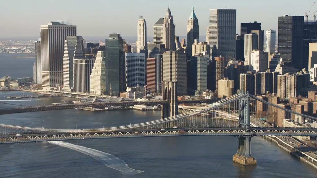 A bridge over a river in a city.