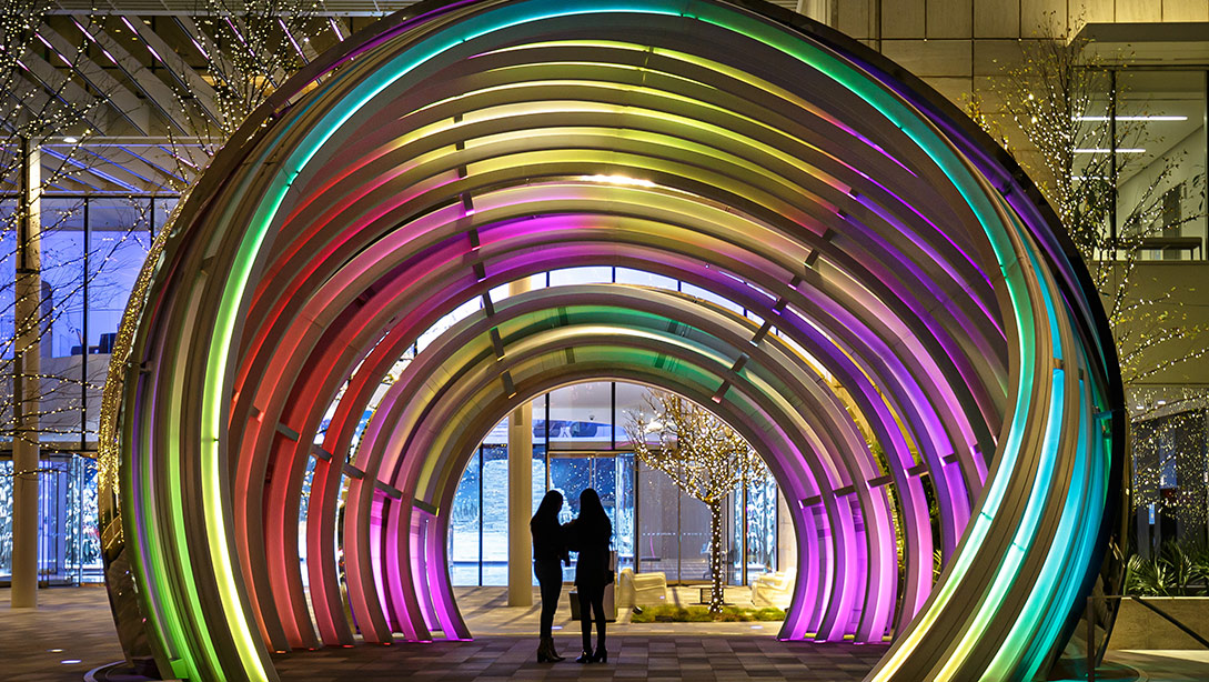 A couple walking through a building.