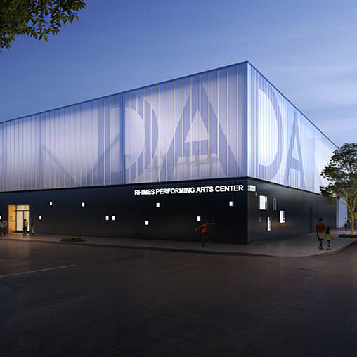 A large building with a large glass wall.