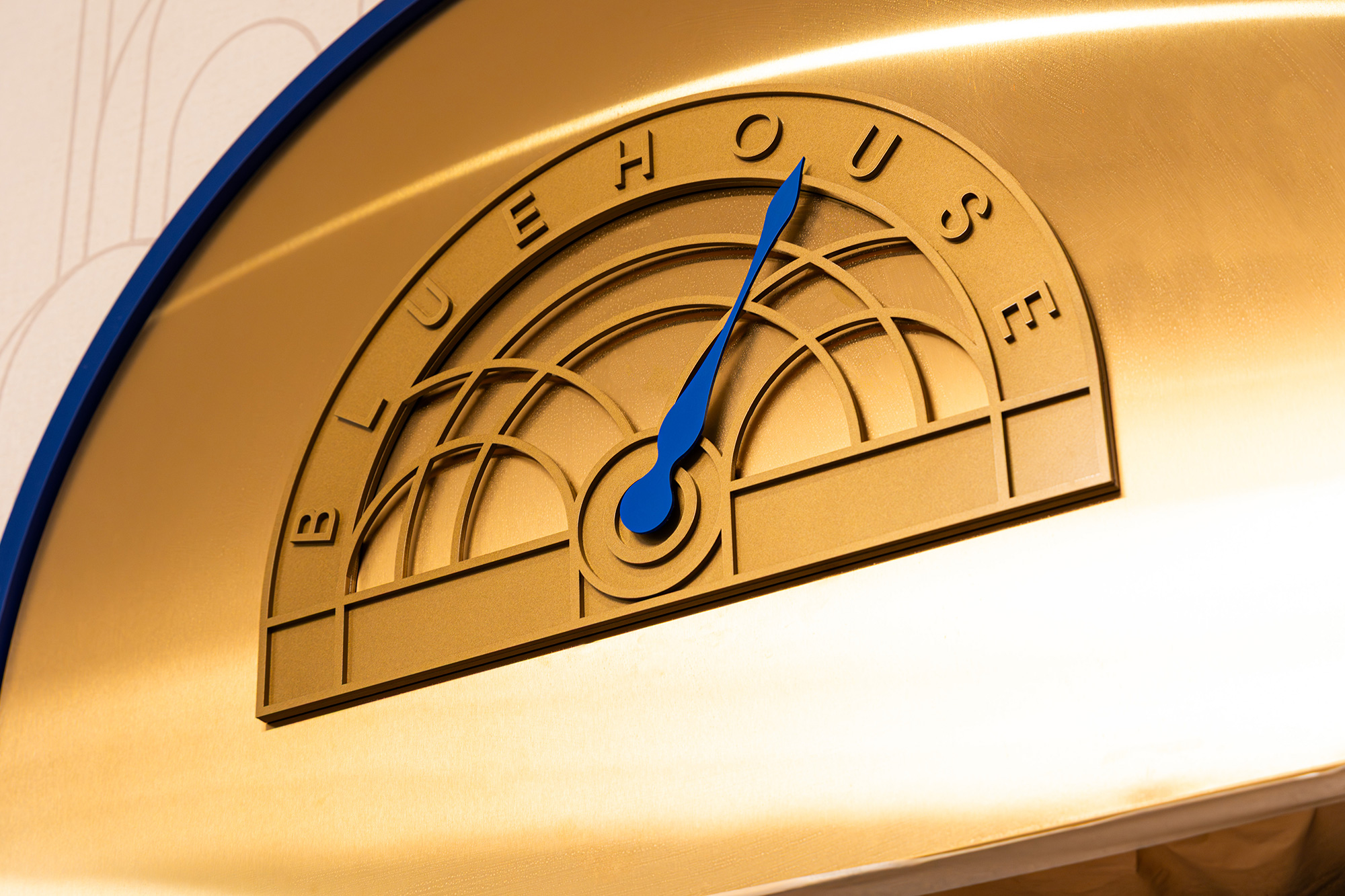 A clock with a blue pen.