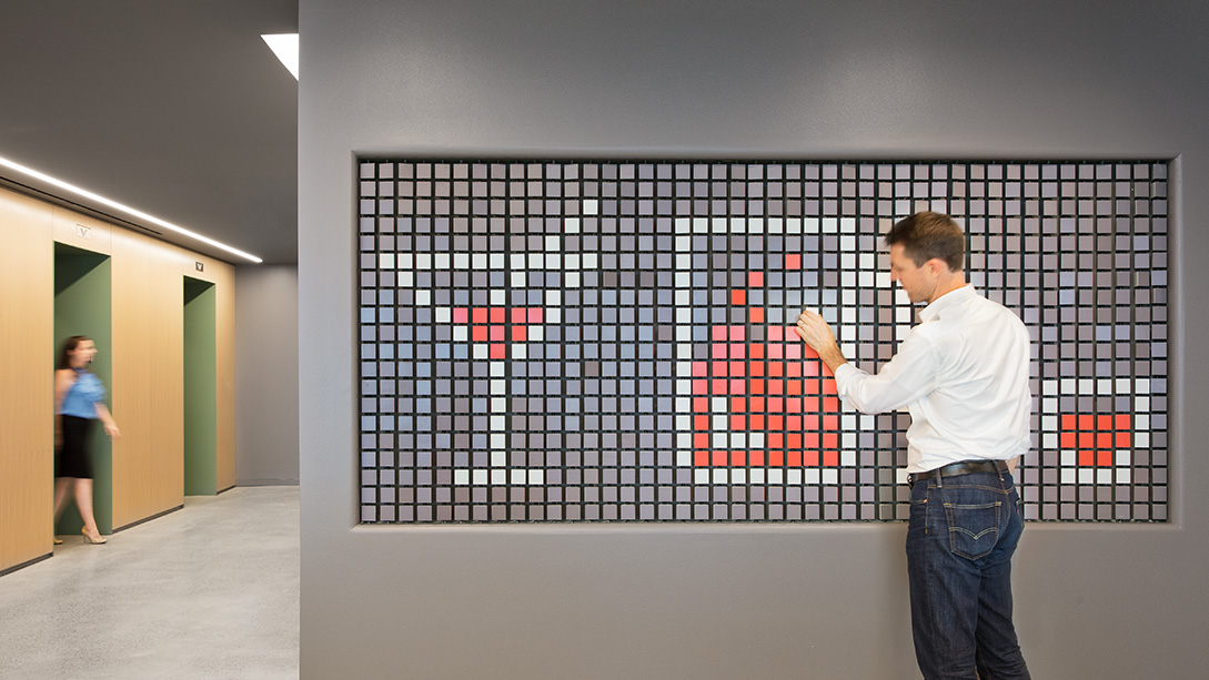 A man pointing at a screen.