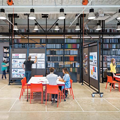 A group of people in a library.