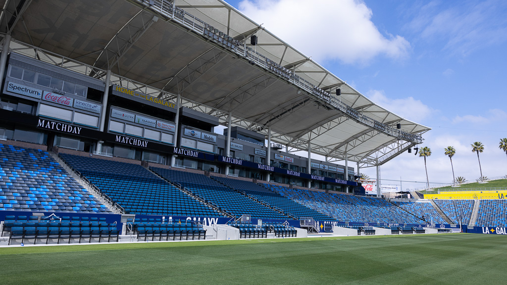 A sports stadium with a field.