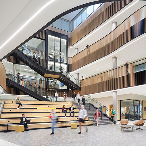 A large atrium with a multi level staircase in the Barton School of Business at Wichita State University
