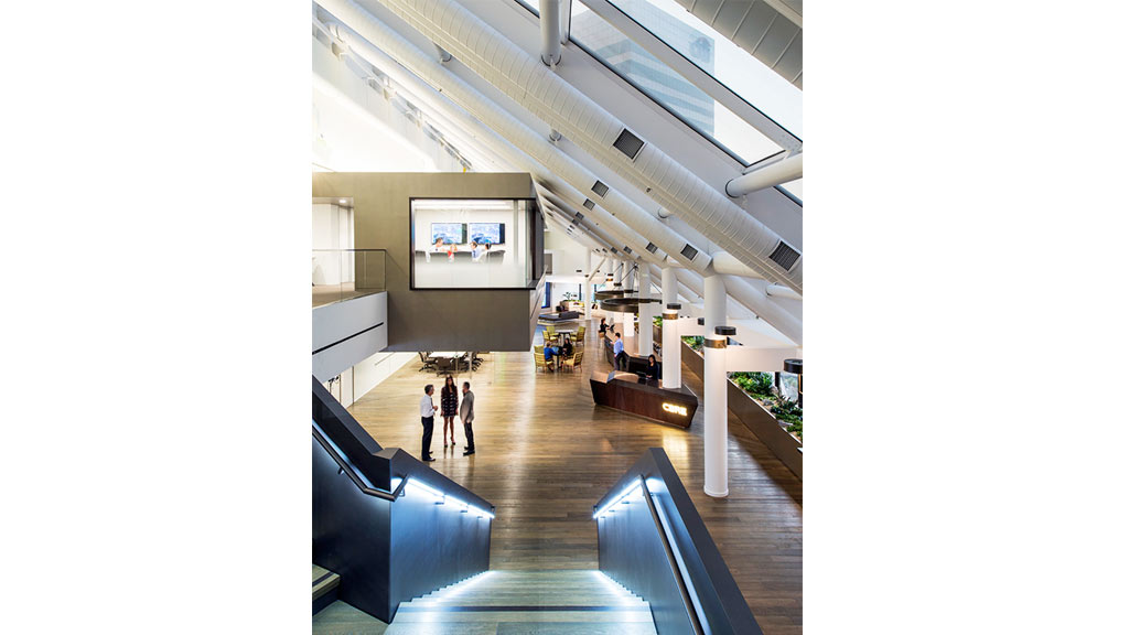 A group of people walking through a building.