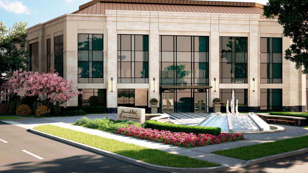 A building with a fountain in front.