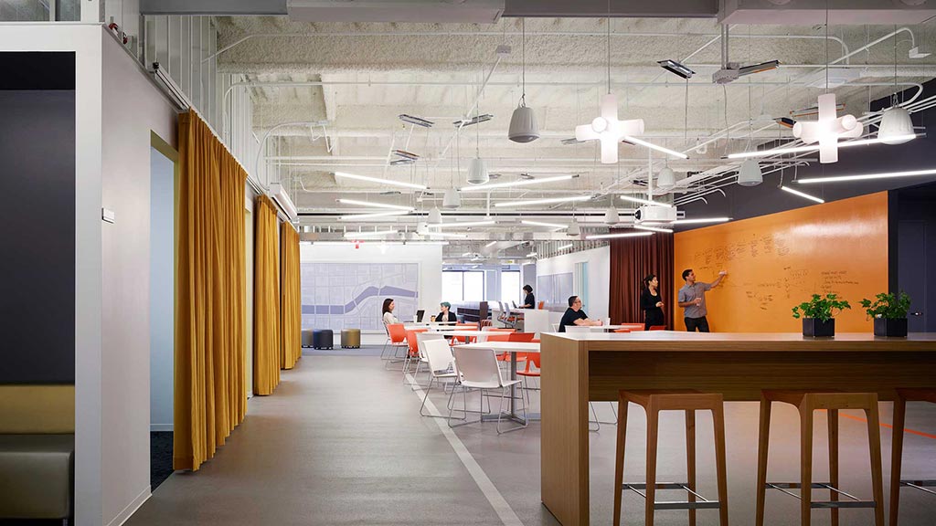 A room with tables and chairs.
