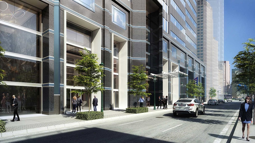 A street with cars and people on it next to a building.