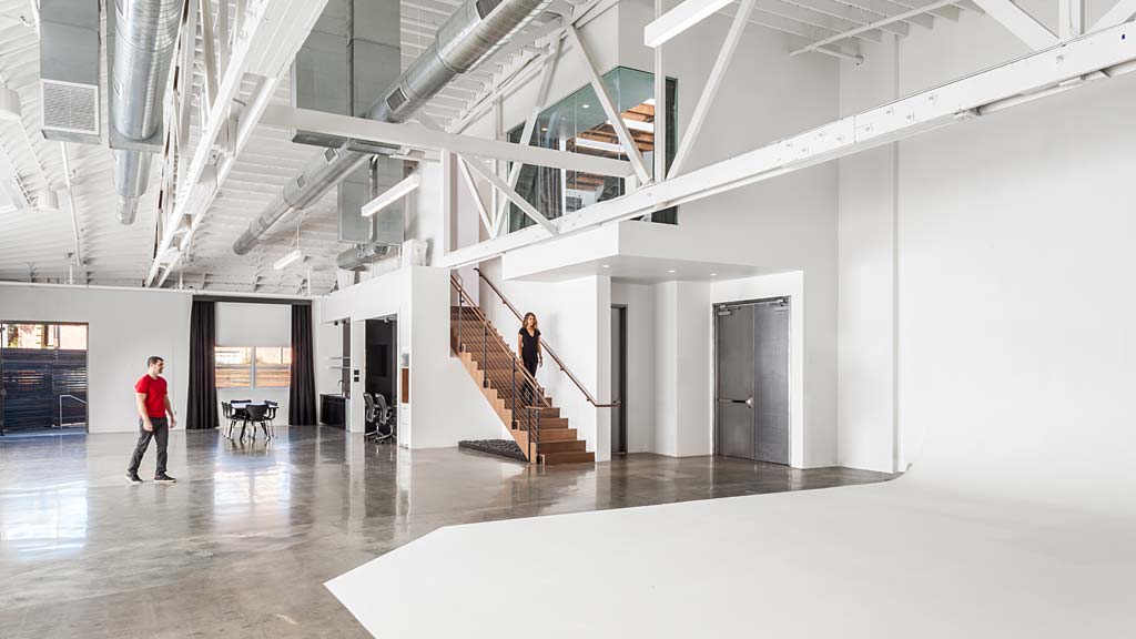 A person walking down a hall.