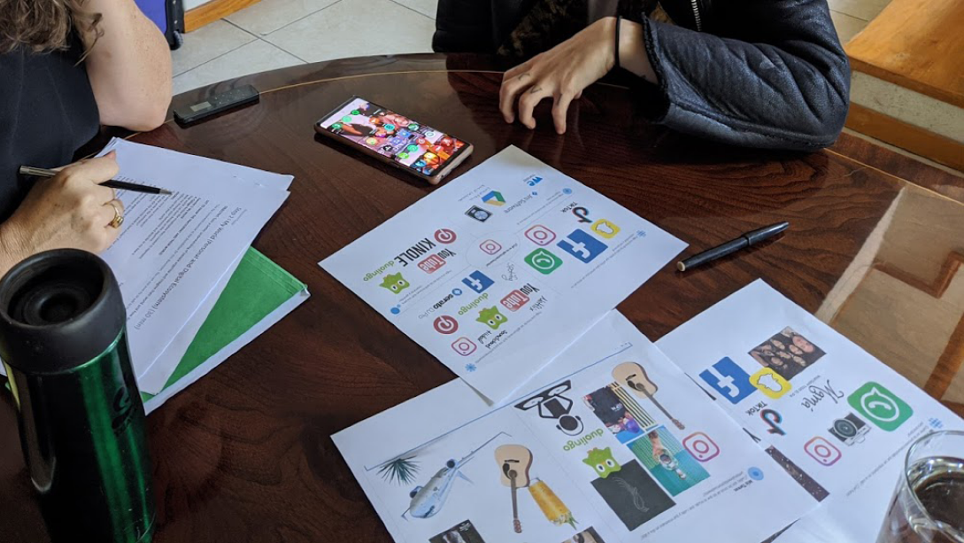 A table with a few pieces of paper on it.